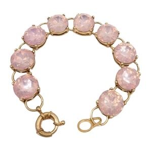Pink crystal link bracelet with 14mm round stones and gold-tone setting, 7.5 inc